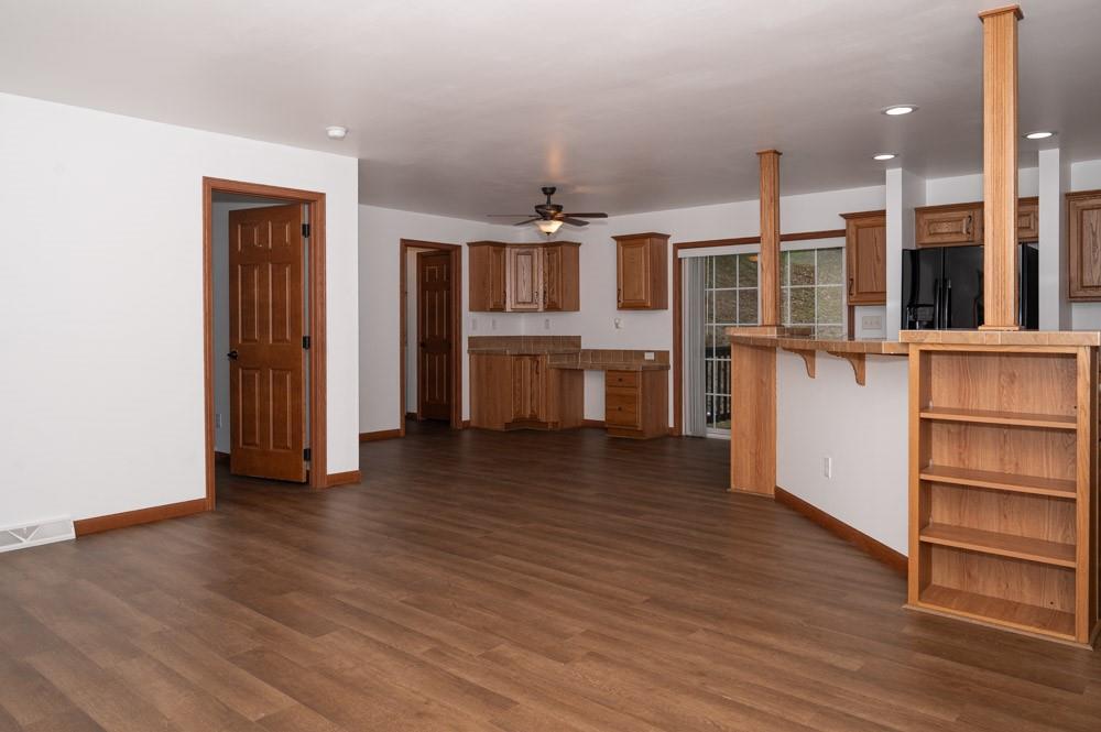 116 Autumn Street Aliquippa, PA 15001 - Photo 11 of 26 wooden floor in an empty room with a window