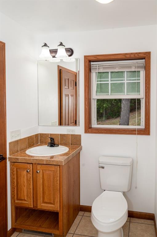 116 Autumn Street Aliquippa, PA 15001 - Photo 14 of 26 a bathroom with a toilet sink and mirror