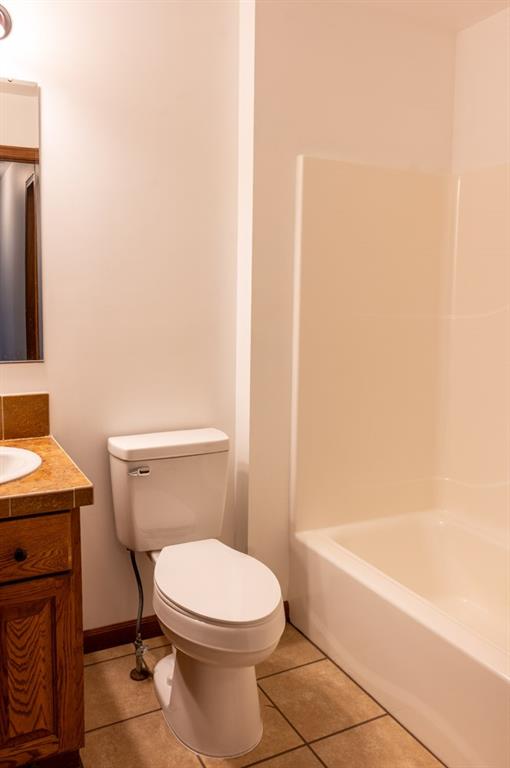 116 Autumn Street Aliquippa, PA 15001 - Photo 18 of 26 a white toilet sitting next to a bath tub