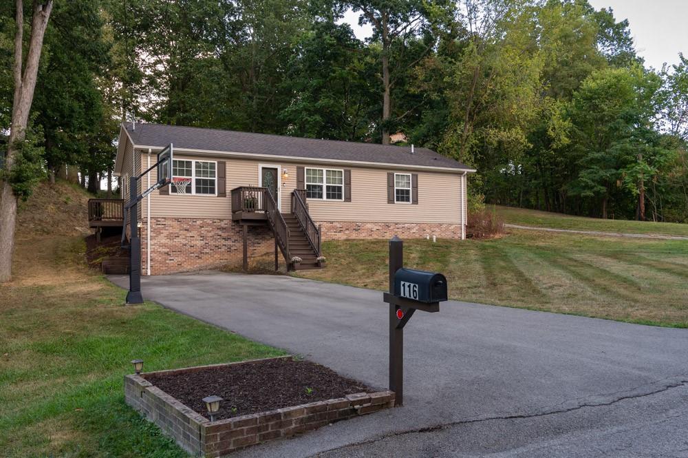 116 Autumn Street Aliquippa, PA 15001 - Photo 3 of 26 a front view of a house with garden