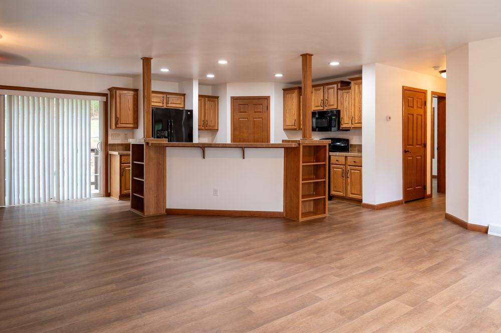 116 Autumn Street Aliquippa, PA 15001 - Photo 7 of 26 a view of kitchen with stainless steel appliances refrigerator stove microwave and cabinets