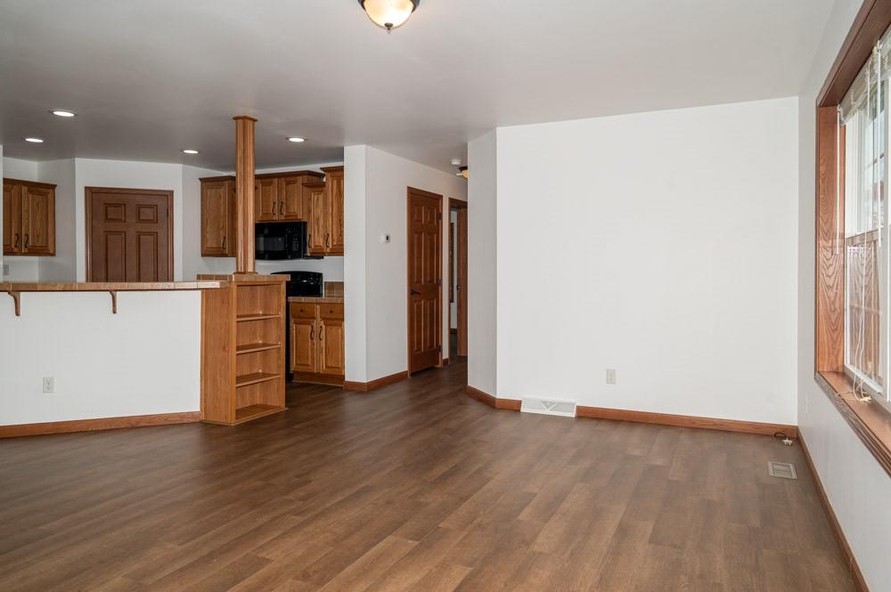 116 Autumn Street Aliquippa, PA 15001 - Photo 8 of 26 an empty room with wooden floor and a window