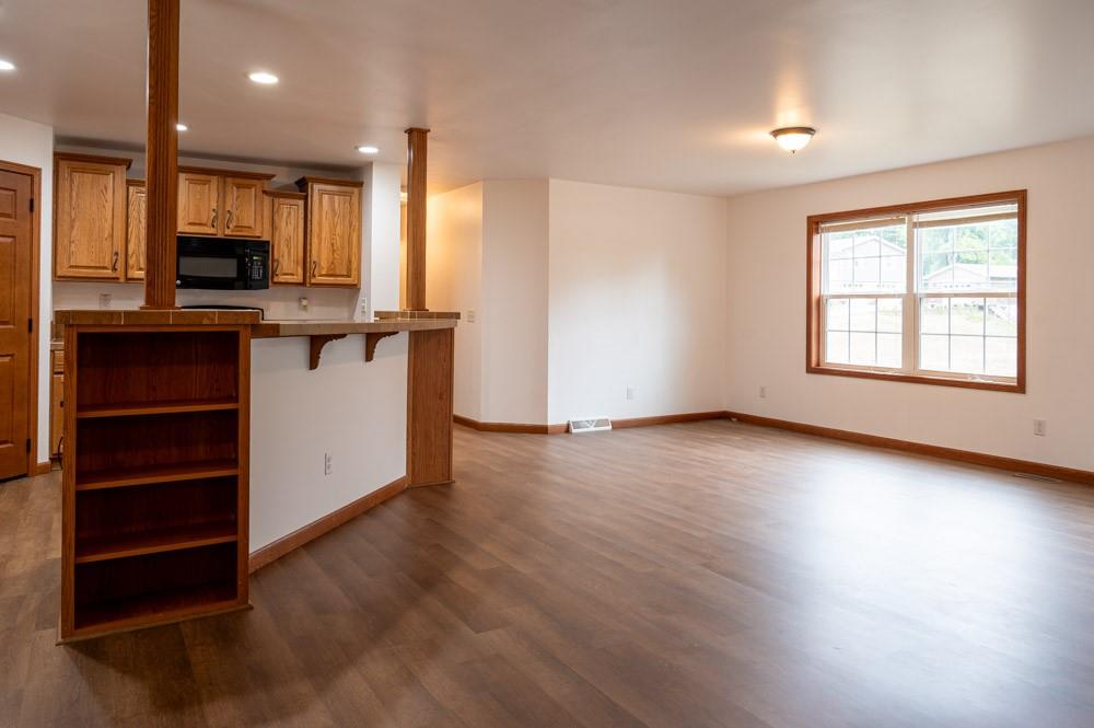 116 Autumn Street Aliquippa, PA 15001 - Photo 9 of 26 an empty room with wooden floor closet and windows