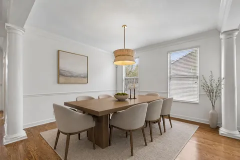 a dining room with furniture and window