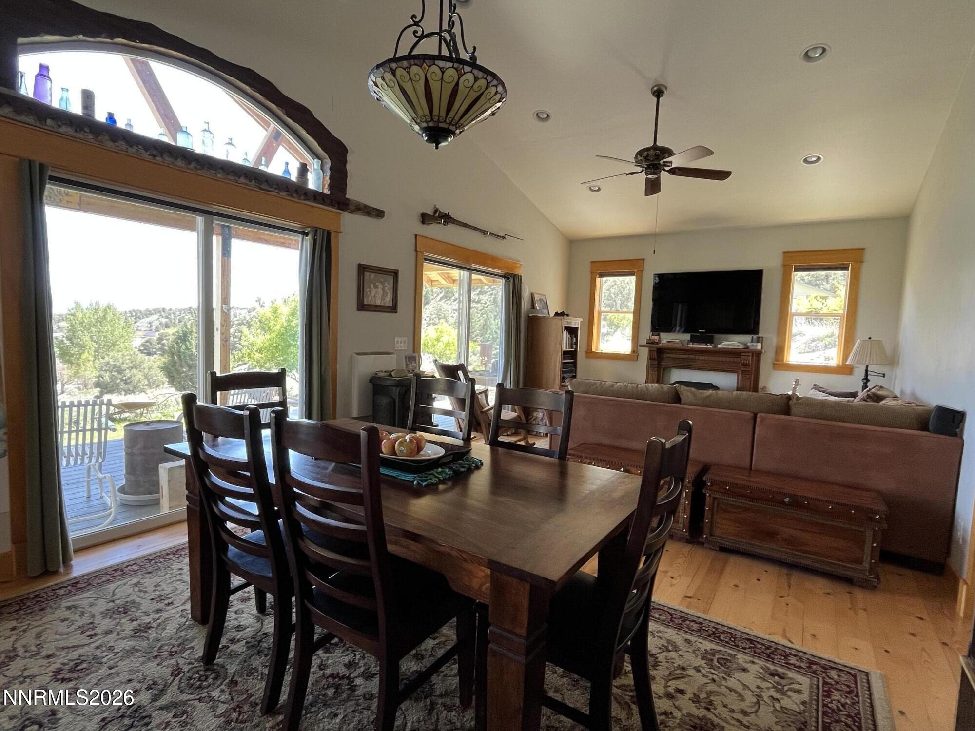 15 Wine Glass Way Kingston, NV 89310 - Photo 18 of 59 a view of a dining room with furniture window and wooden floor