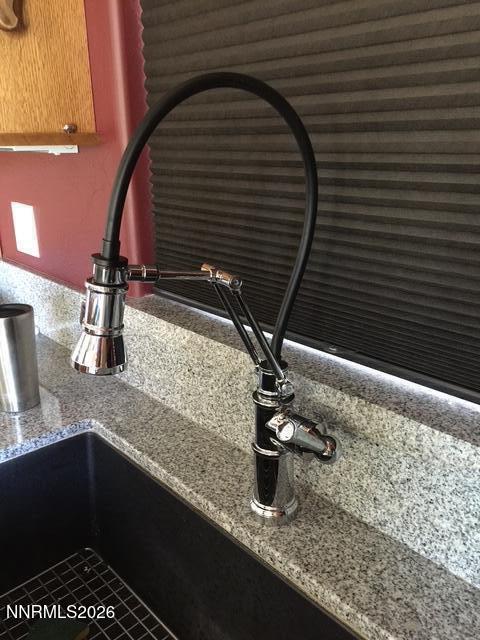 15 Wine Glass Way Kingston, NV 89310 - Photo 23 of 59 a bathroom with a granite countertop sink