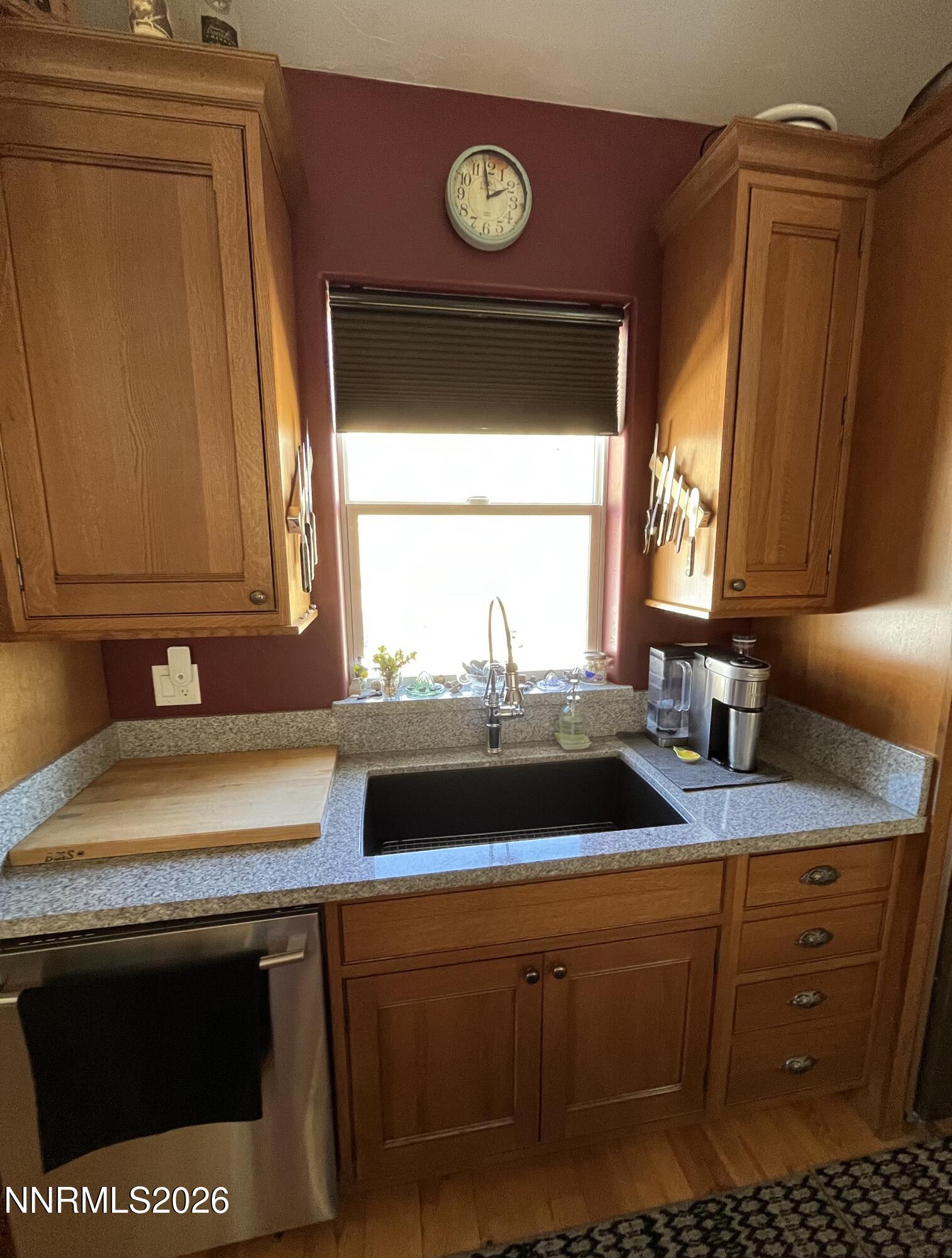 15 Wine Glass Way Kingston, NV 89310 - Photo 24 of 59 a kitchen with a sink a stove and a microwave