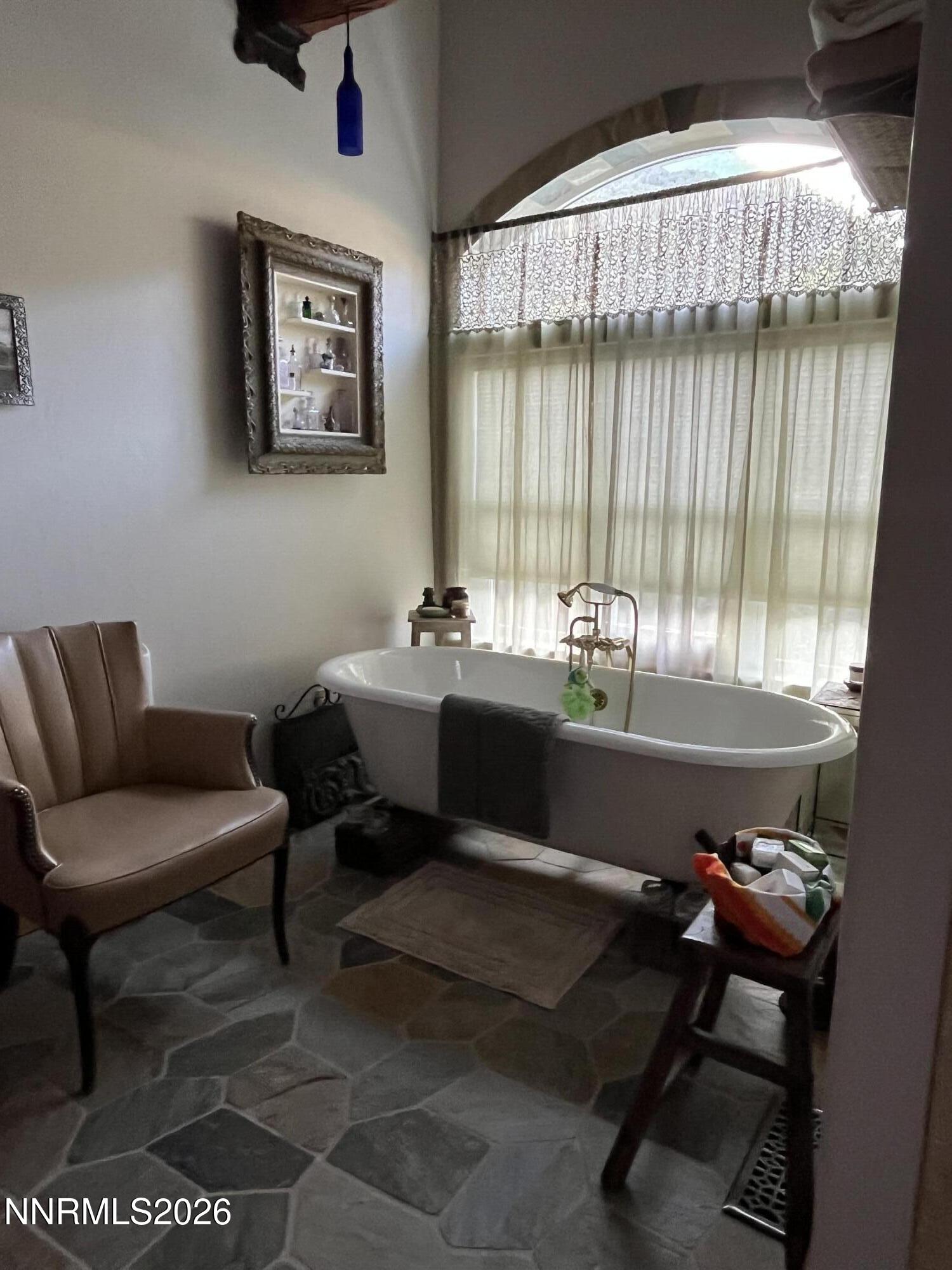 15 Wine Glass Way Kingston, NV 89310 - Photo 34 of 59 a living room with a couch and a window