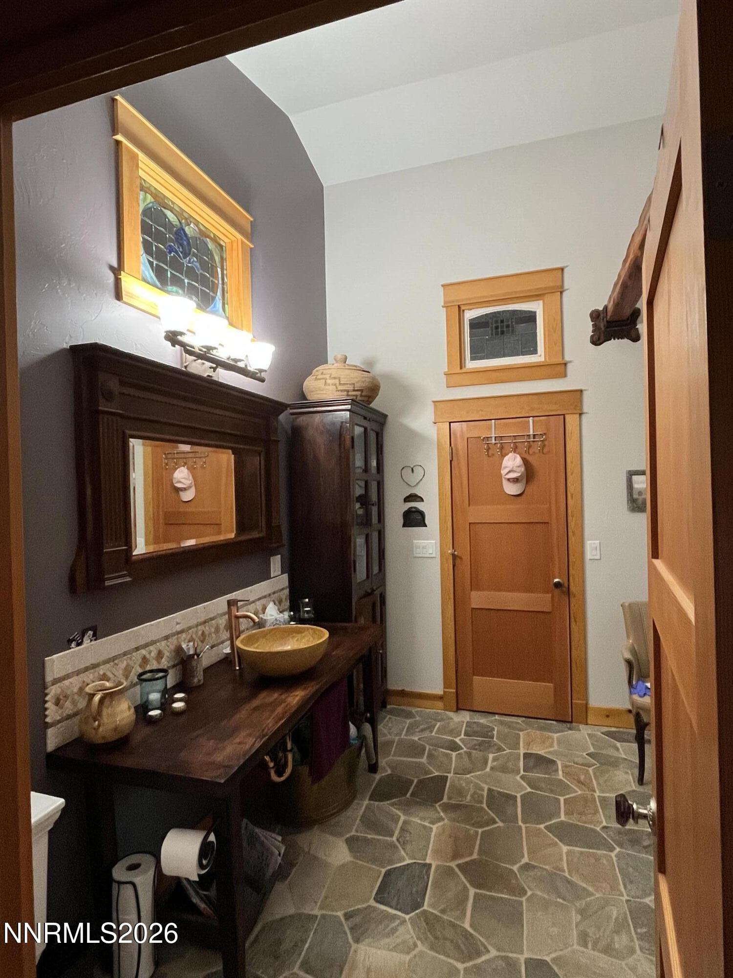 15 Wine Glass Way Kingston, NV 89310 - Photo 41 of 59 a bathroom with a sink and a mirror