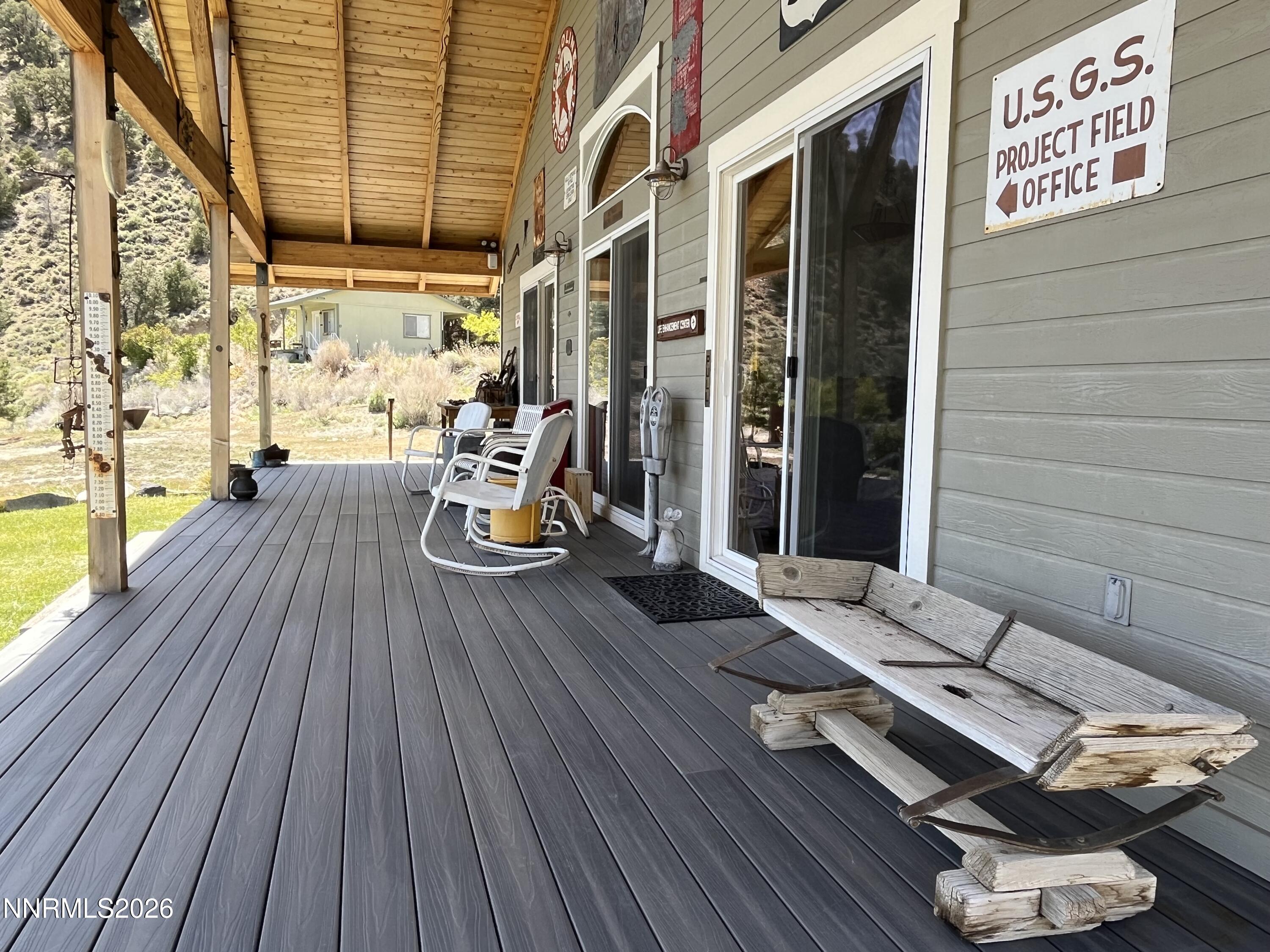 15 Wine Glass Way Kingston, NV 89310 - Photo 8 of 59 a view of a chairs in wooden deck