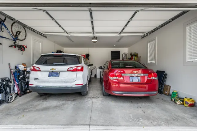 a car and bike parked in a garage