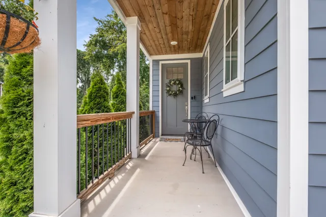 a view of balcony with furniture