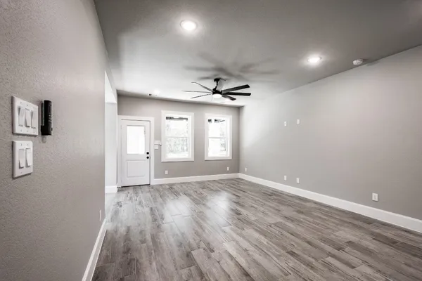 a view of an empty room and glass door
