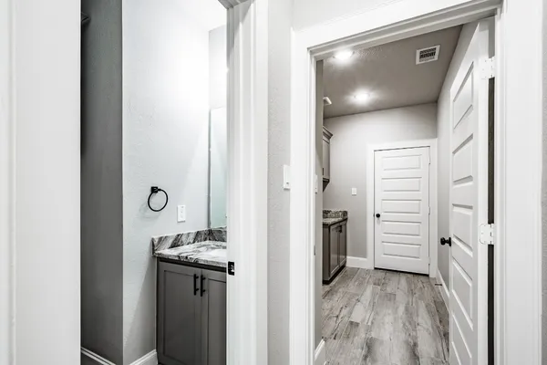 a bathroom with a sink and a mirror