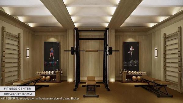 a view of a livingroom with furniture and floor to ceiling window