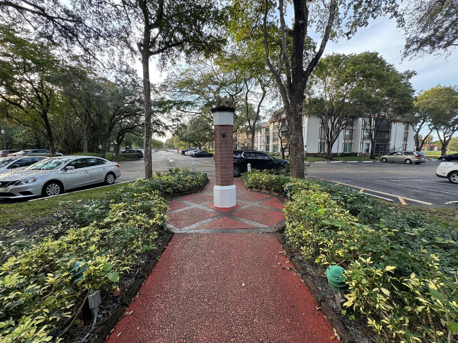 3730 Inverrary Drive, Unit 3B Lauderhill, FL 33319 - Photo 14 of 53 a view of a garden with large tree