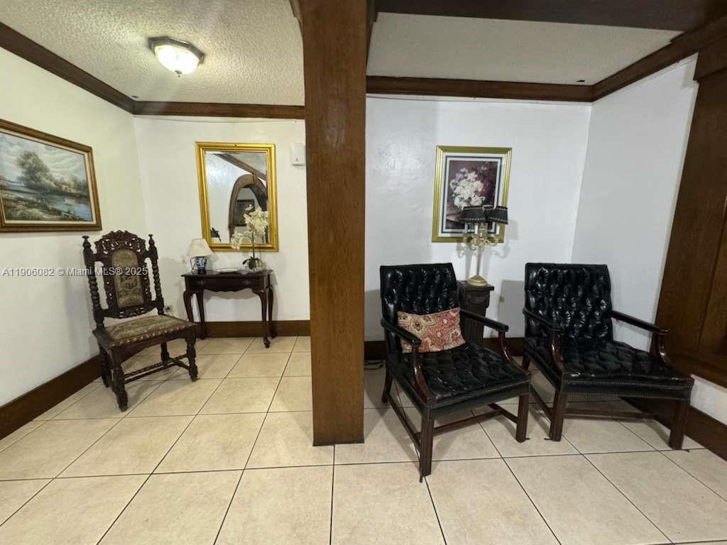 3730 Inverrary Drive, Unit 3B Lauderhill, FL 33319 - Photo 18 of 53 a living room with furniture and a painting on the wall