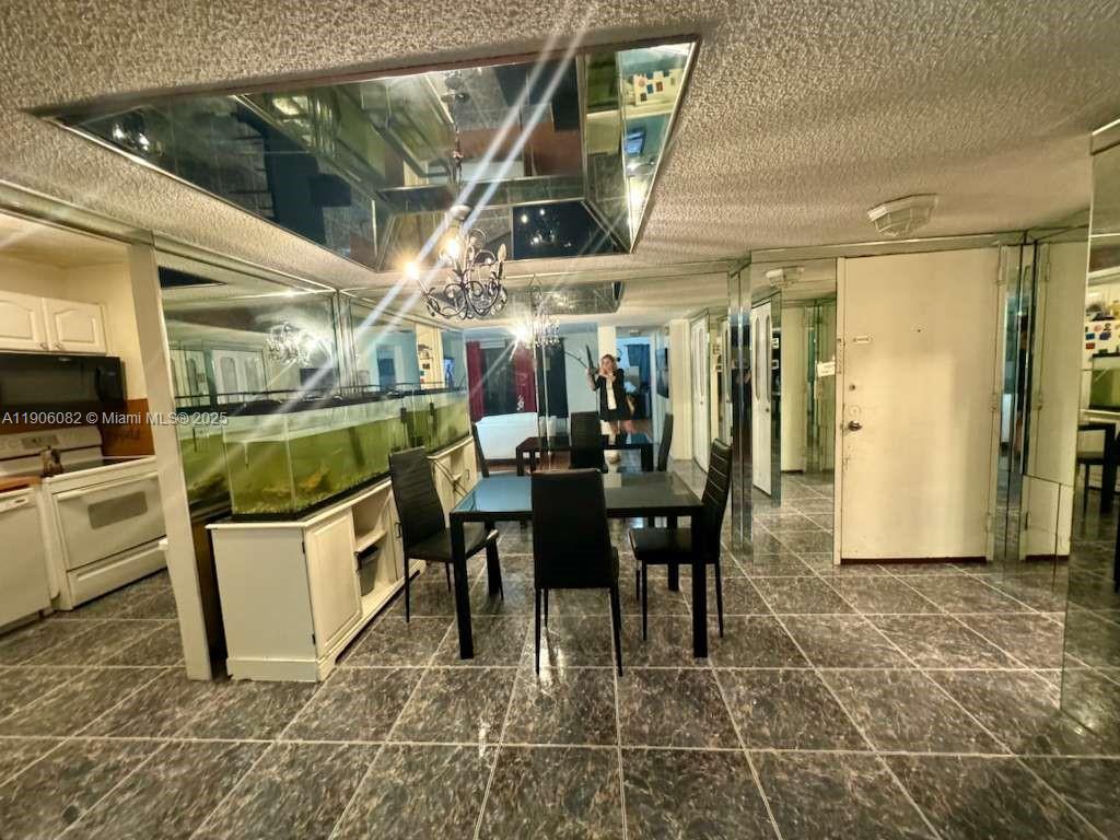 3730 Inverrary Drive, Unit 3B Lauderhill, FL 33319 - Photo 23 of 53 a view of a dining room with furniture