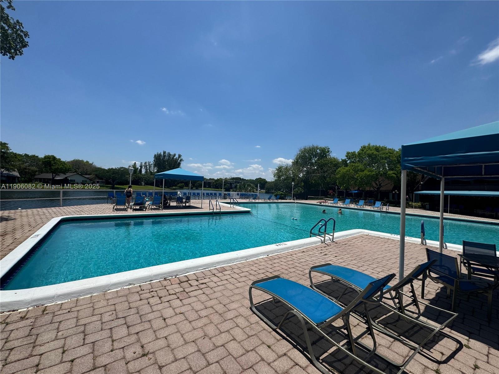 3730 Inverrary Drive, Unit 3B Lauderhill, FL 33319 - Photo 7 of 53 a view of swimming pool with chairs