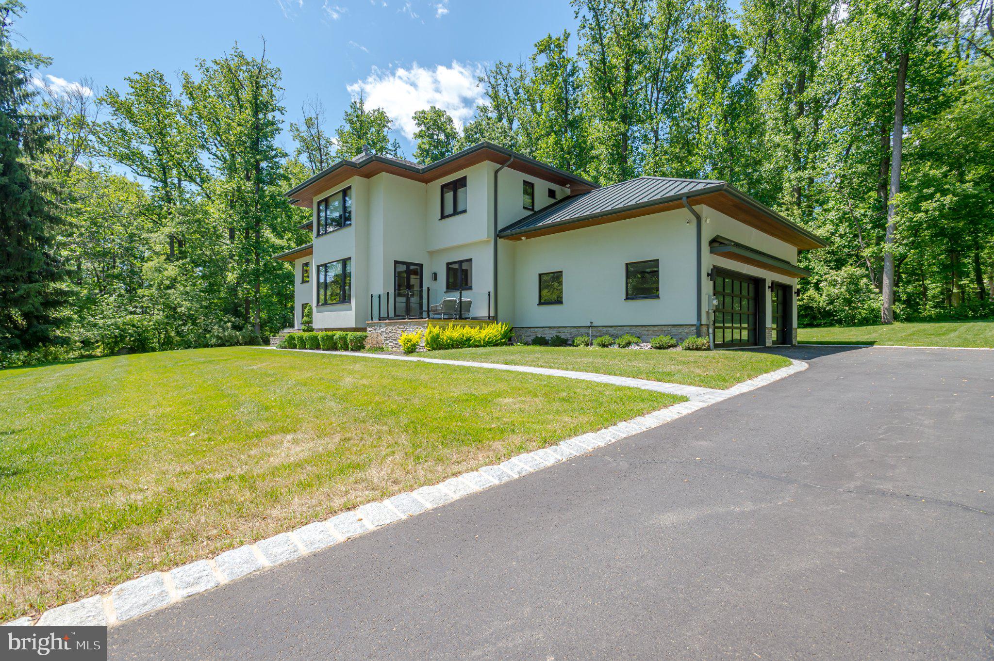 1267 Stuart Road Princeton, NJ 08540 - Photo 2 of 40 Modern home nestled in lush greenery.