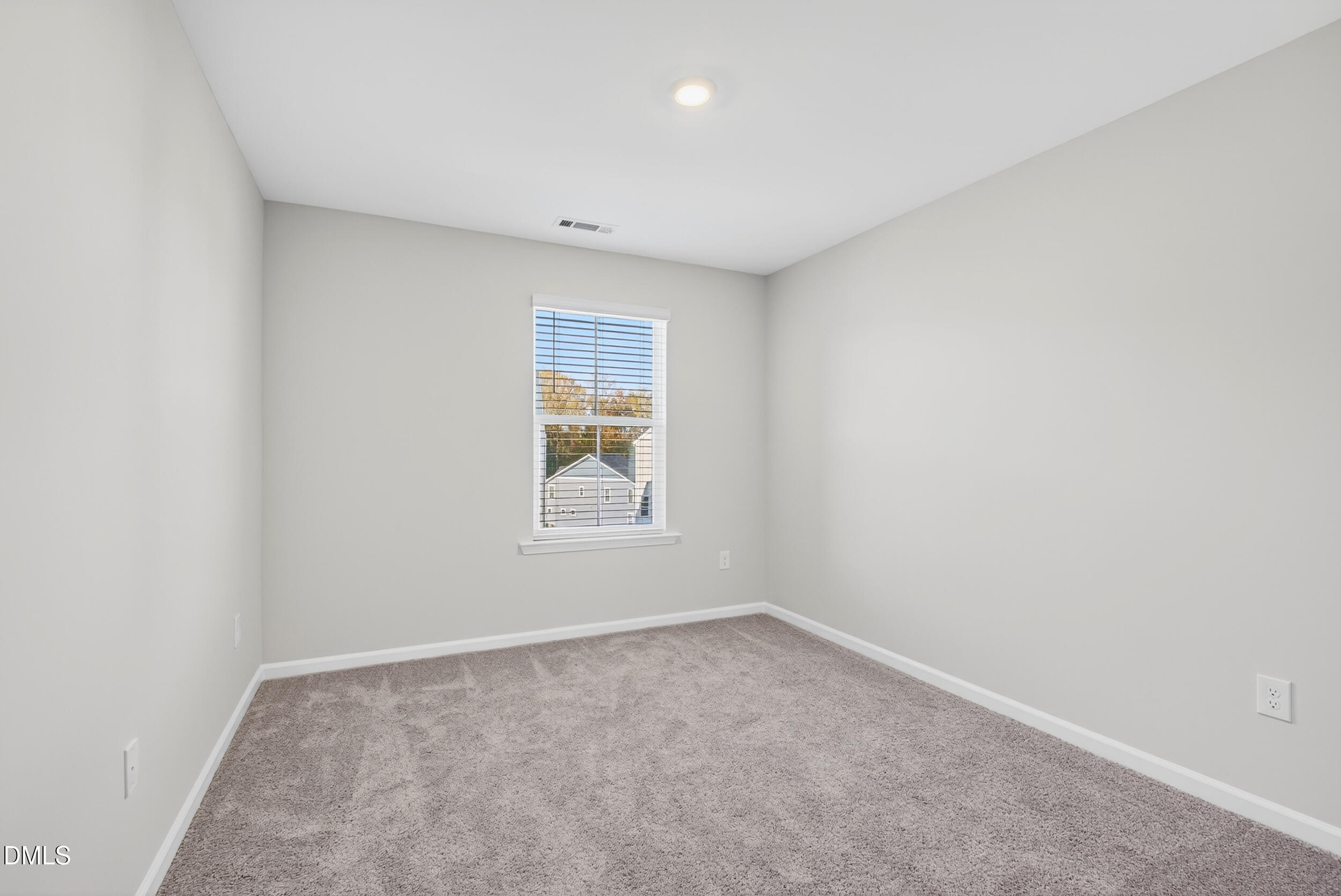 331 Chesapeake Commons Street Garner, NC 27529 - Photo 13 of 20 an empty room with a window