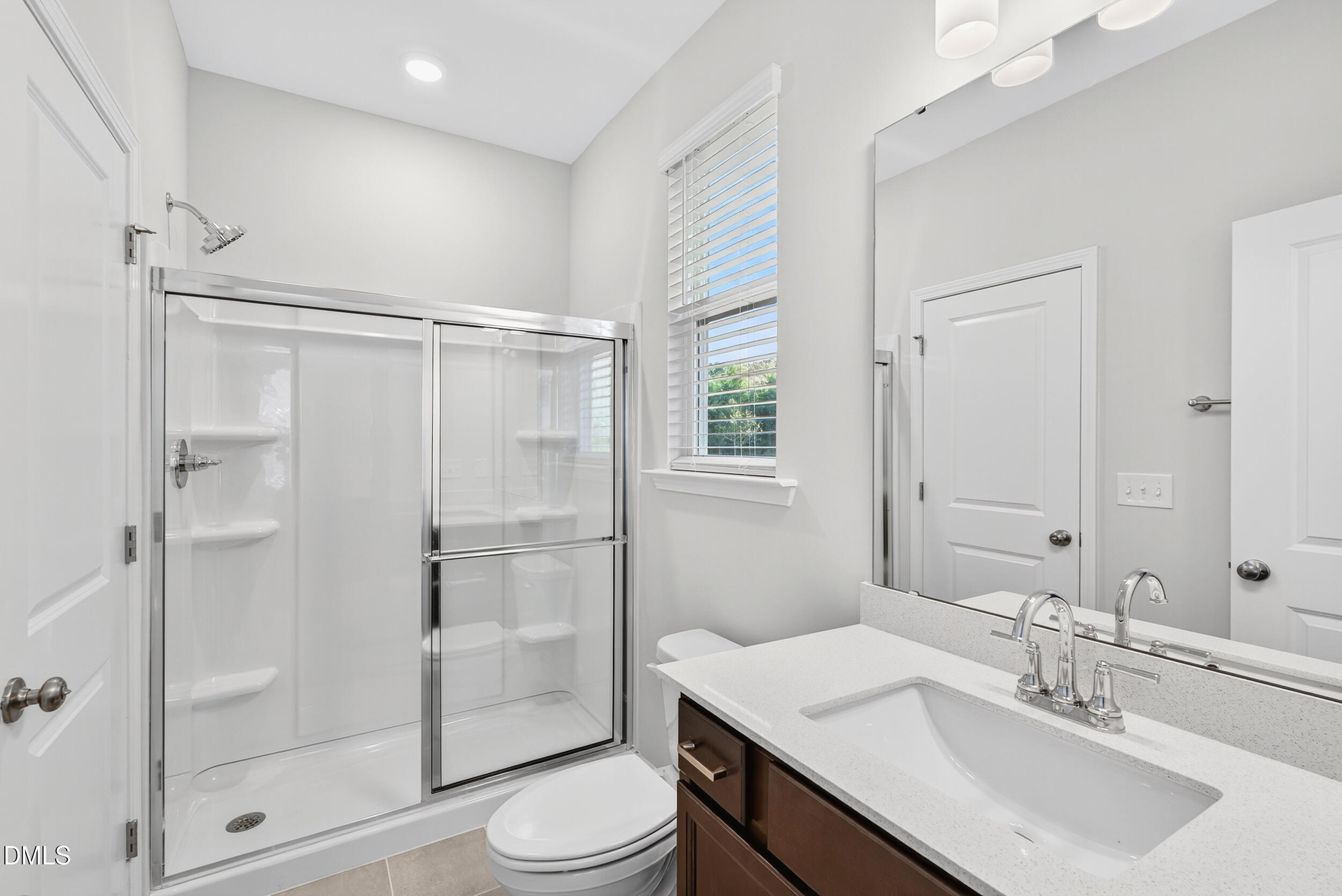 331 Chesapeake Commons Street Garner, NC 27529 - Photo 16 of 20 a bathroom with a sink toilet and shower