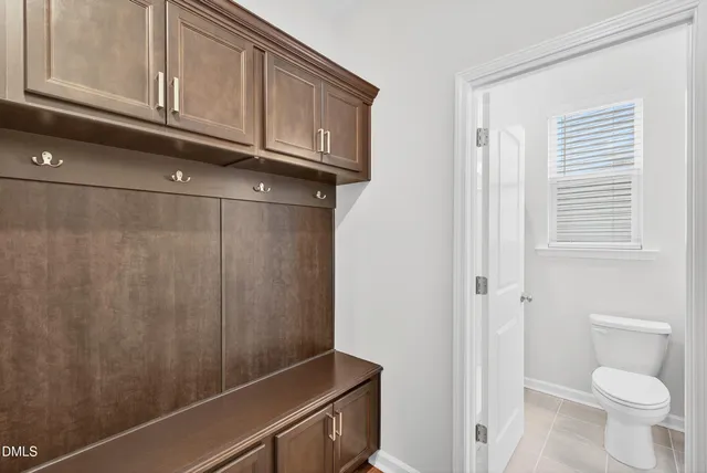 a bathroom with a granite countertop sink and toilet