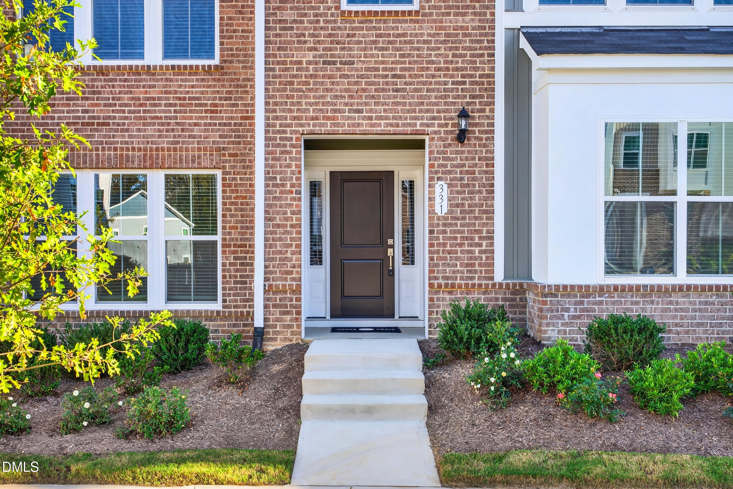 331 Chesapeake Commons Street Garner, NC 27529 - Photo 3 of 20 a front view of a house with a yard