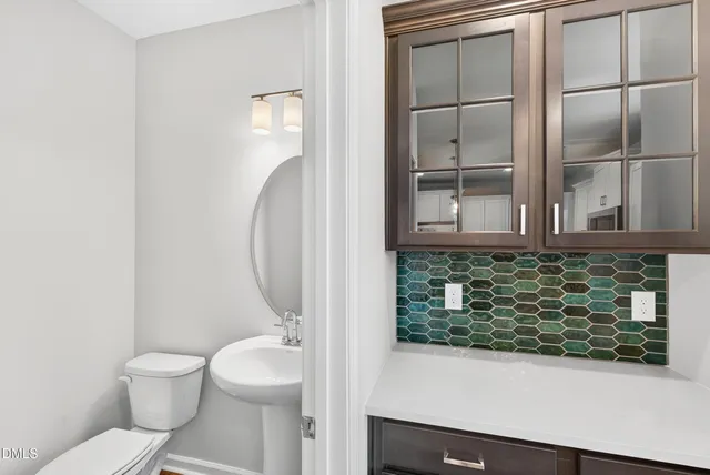 a bathroom with a toilet and a sink