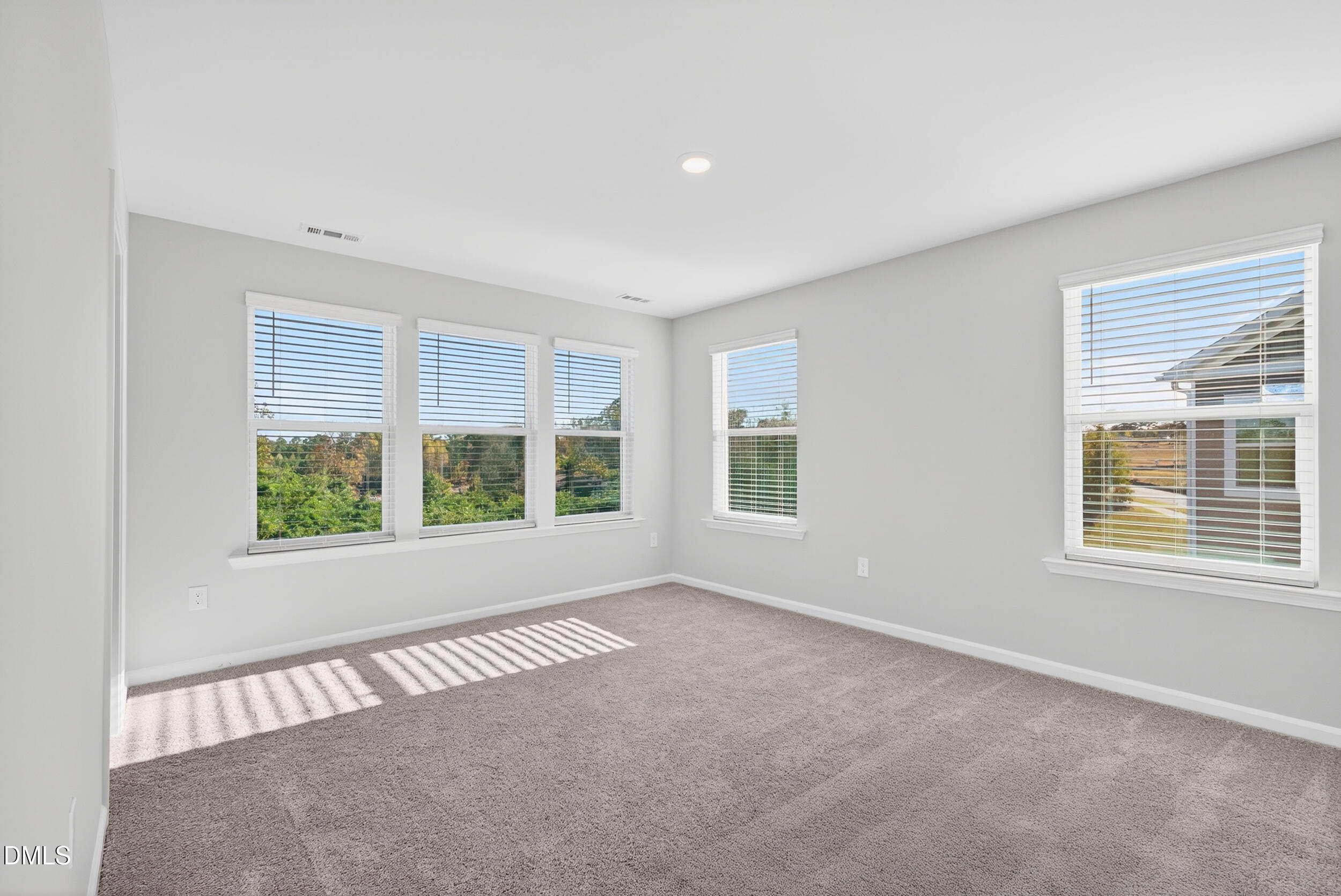 331 Chesapeake Commons Street Garner, NC 27529 - Photo 10 of 20 a view of an empty room with a window