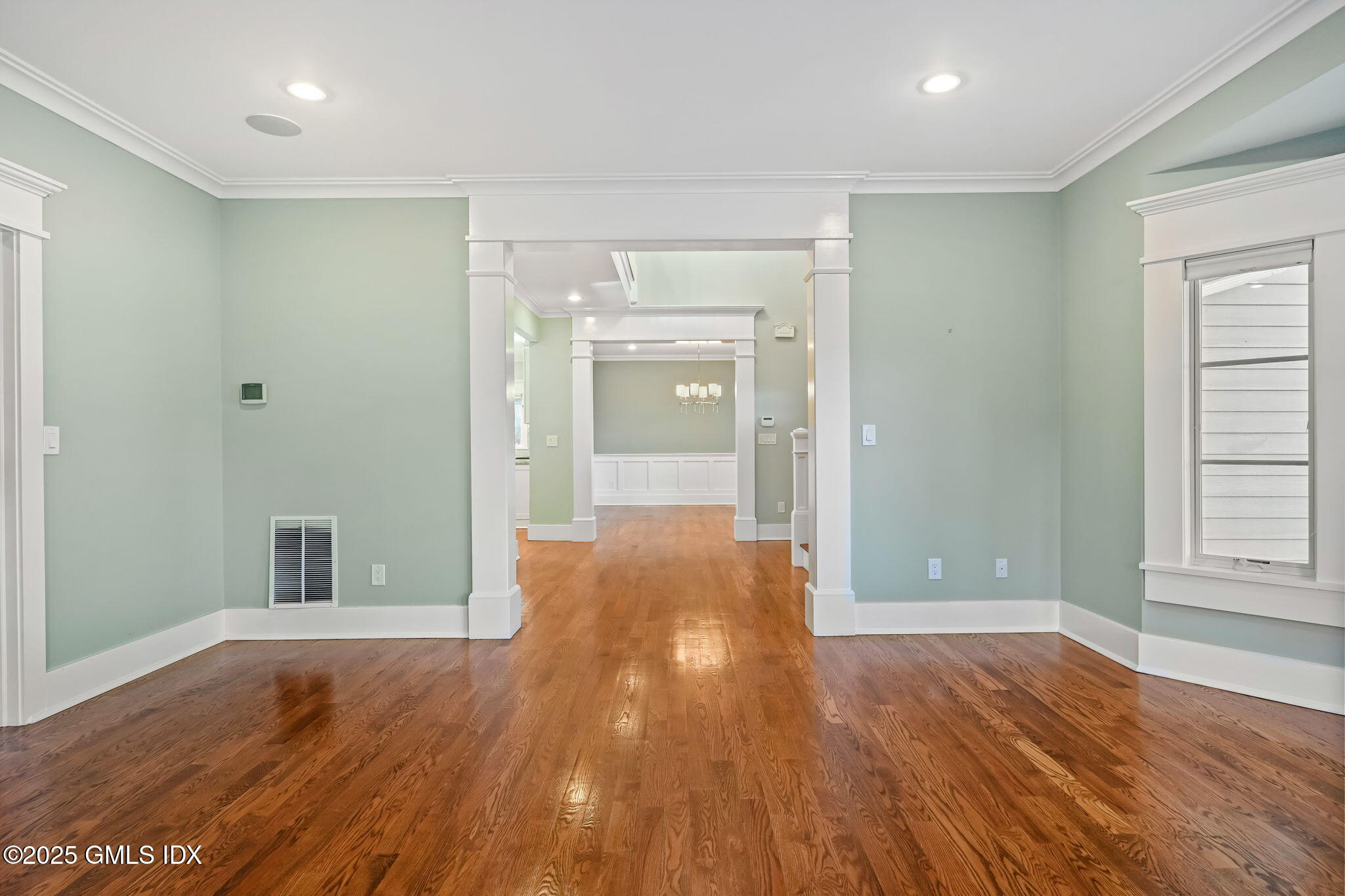 12 Old Wagon Road Old Greenwich, CT 06870 - Photo 11 of 57 wooden floor in an empty room with a window