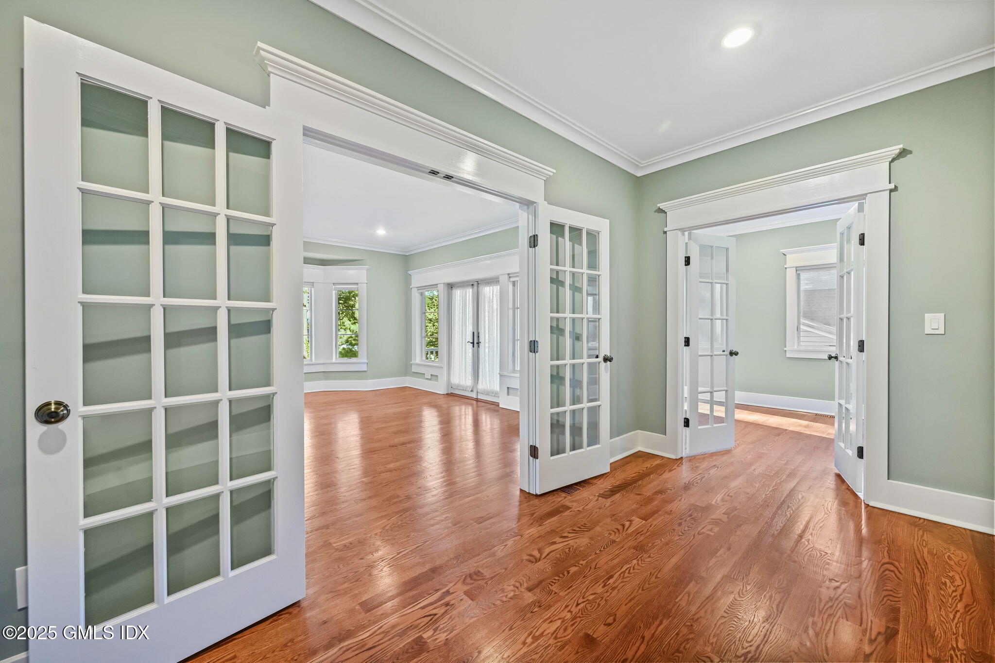 12 Old Wagon Road Old Greenwich, CT 06870 - Photo 13 of 57 a view of empty room with wooden floor and windows