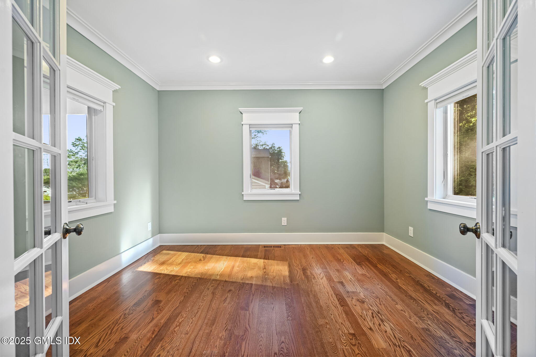 12 Old Wagon Road Old Greenwich, CT 06870 - Photo 15 of 57 a view of room with window and wooden floor