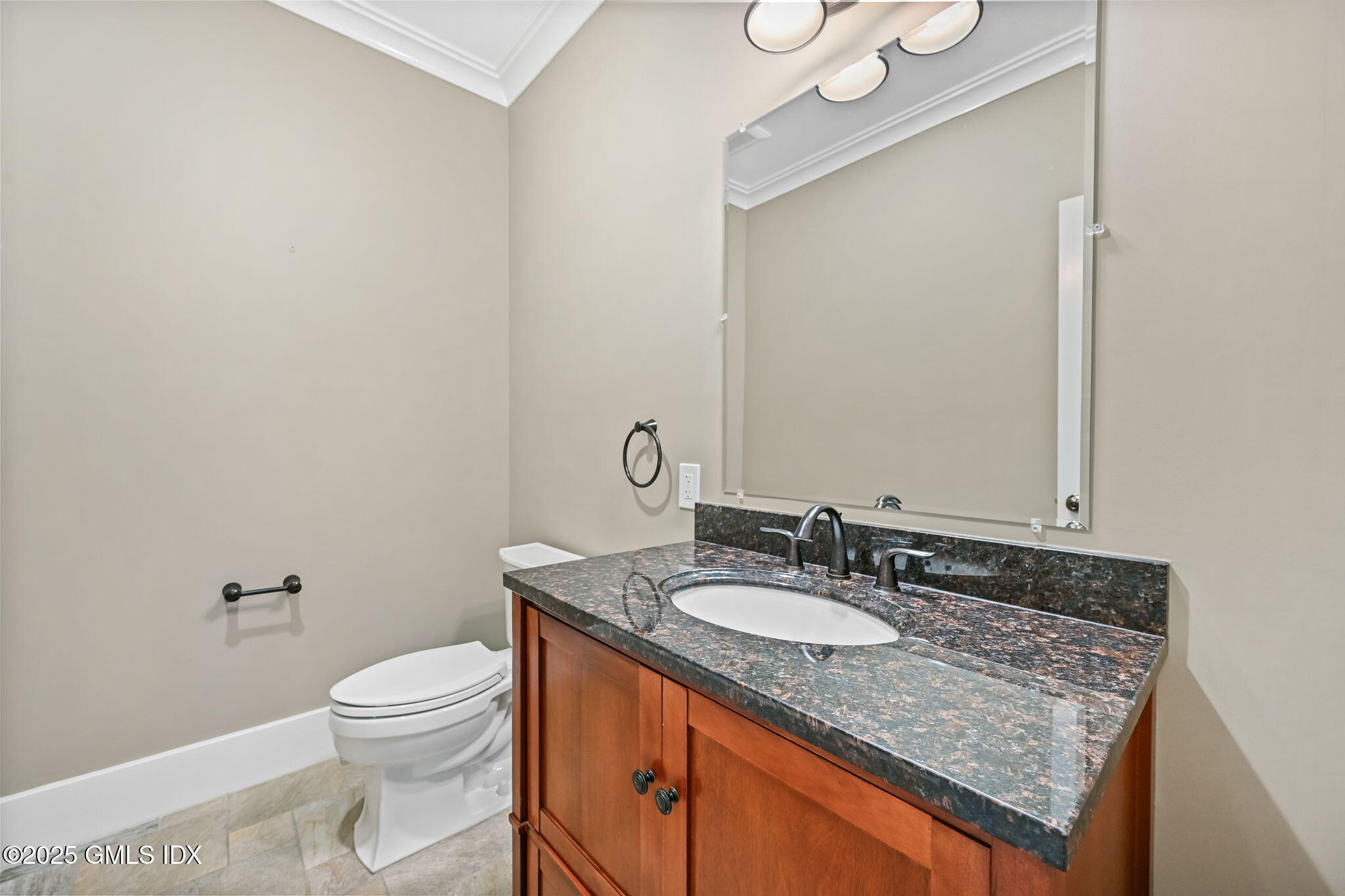 12 Old Wagon Road Old Greenwich, CT 06870 - Photo 16 of 57 a bathroom with a granite countertop sink a toilet and a mirror