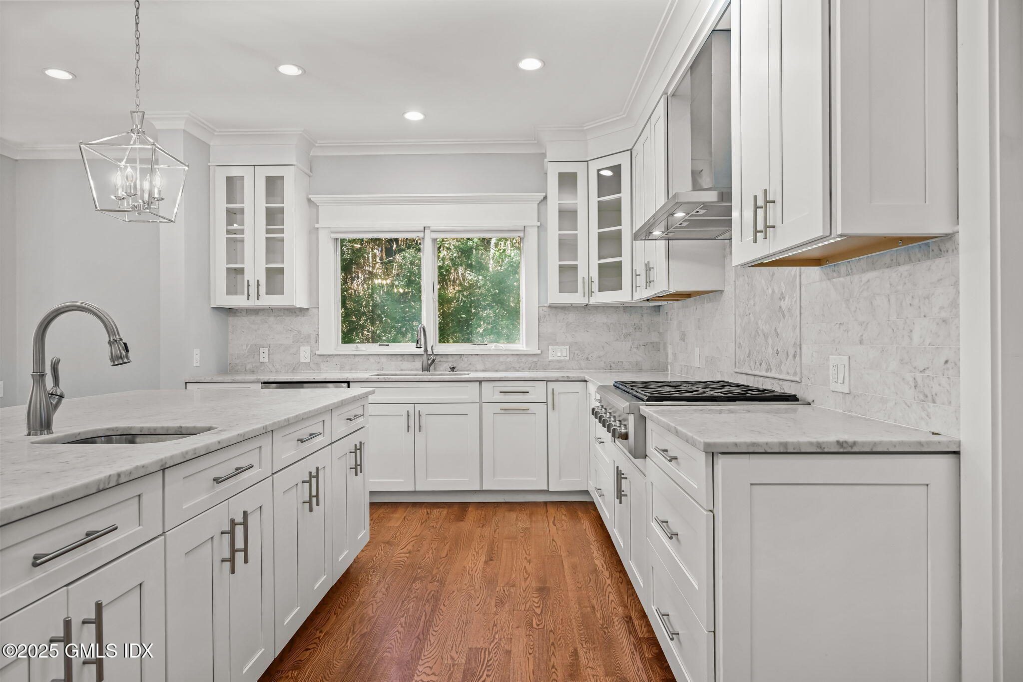 12 Old Wagon Road Old Greenwich, CT 06870 - Photo 21 of 57 a kitchen with granite countertop white cabinets and appliances