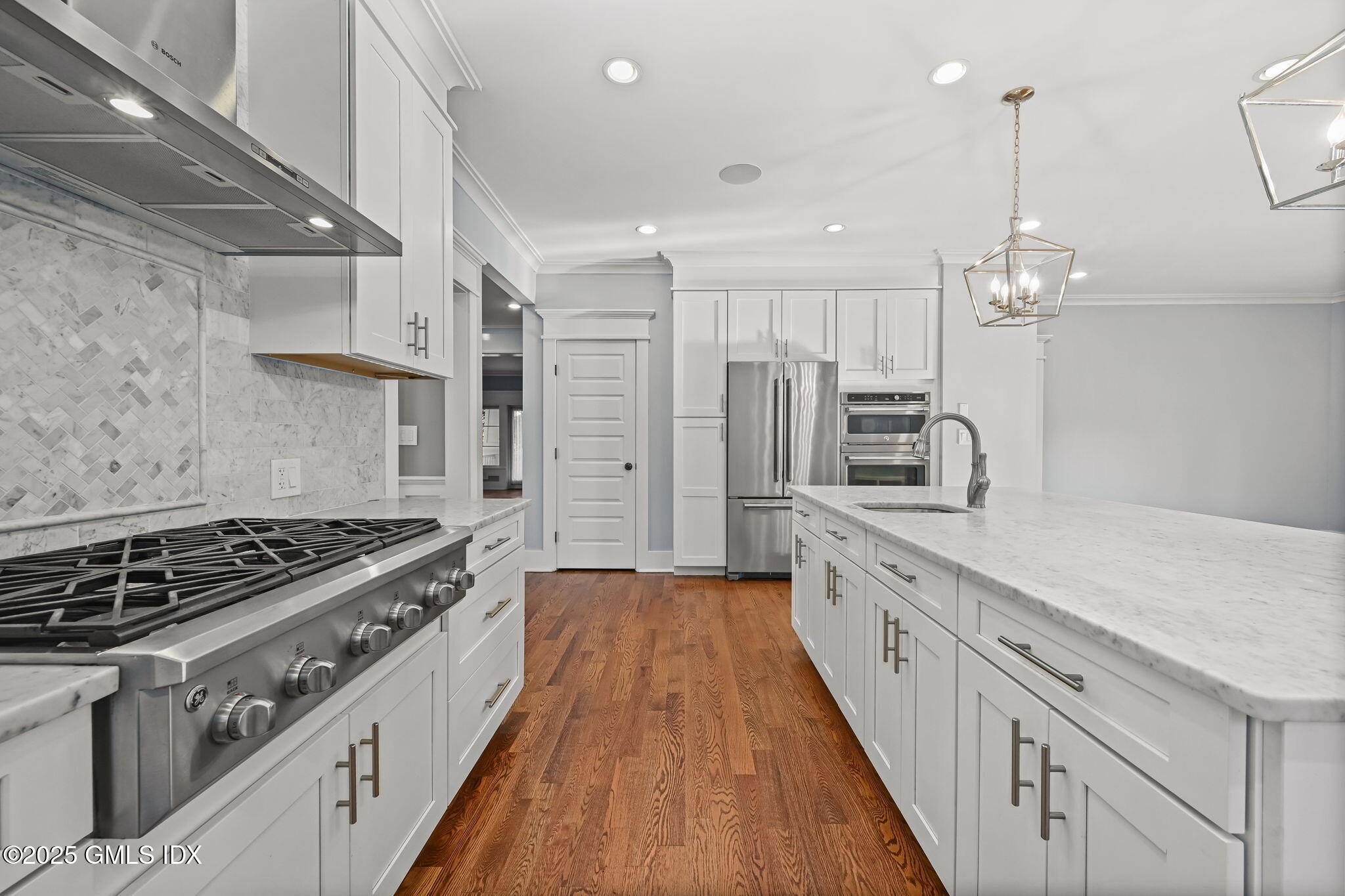 12 Old Wagon Road Old Greenwich, CT 06870 - Photo 22 of 57 a large kitchen with stainless steel appliances granite countertop a stove and a sink