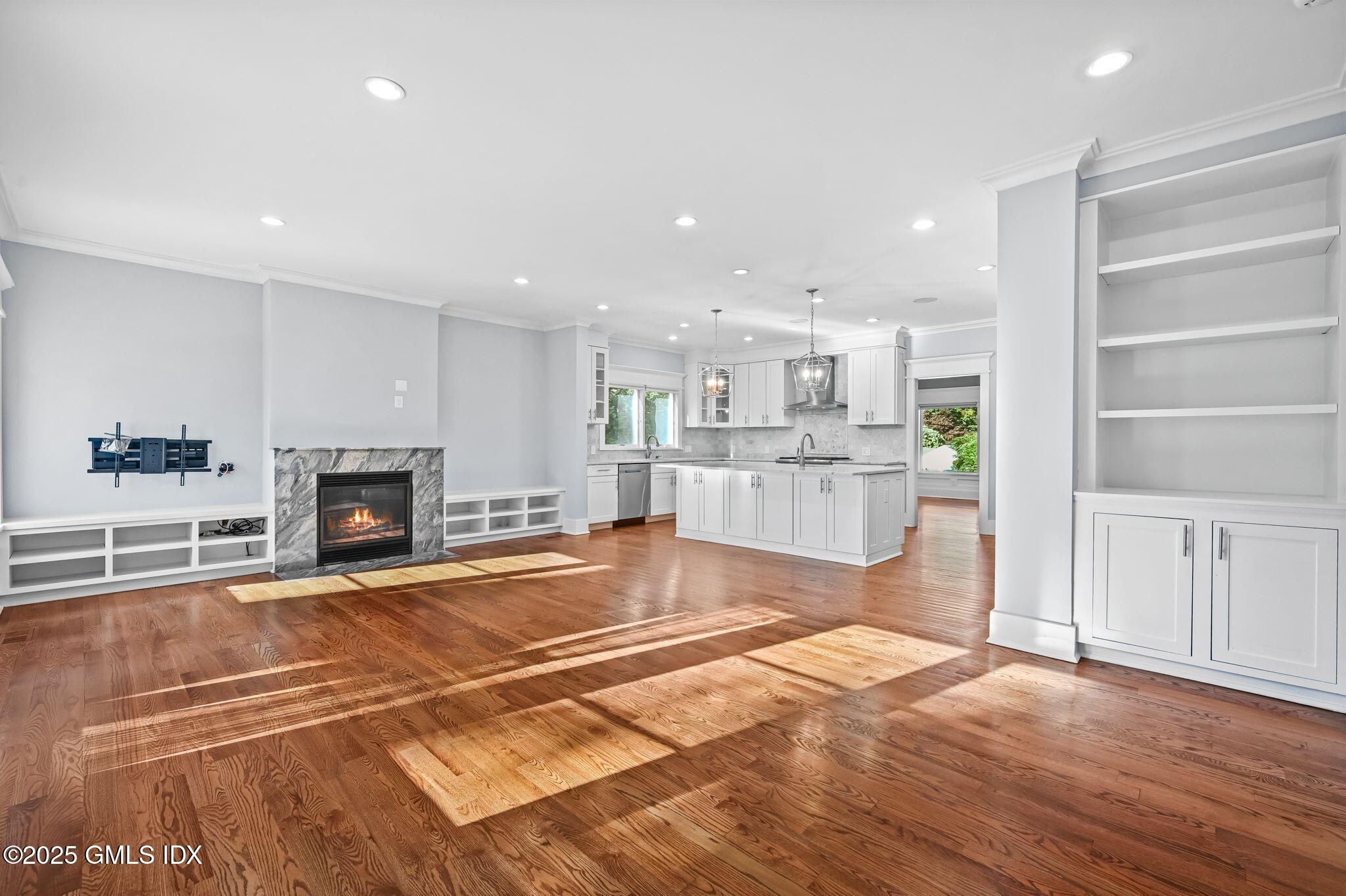 12 Old Wagon Road Old Greenwich, CT 06870 - Photo 25 of 57 a view of a kitchen with kitchen island wooden floors appliances and cabinets