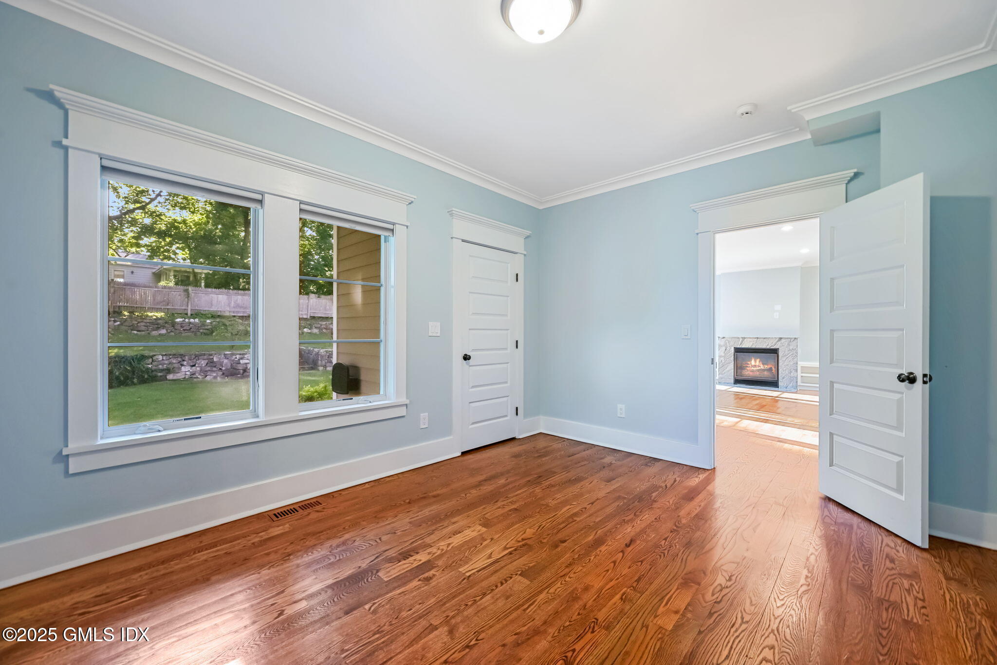 12 Old Wagon Road Old Greenwich, CT 06870 - Photo 27 of 57 a view of empty room with wooden floor and fan