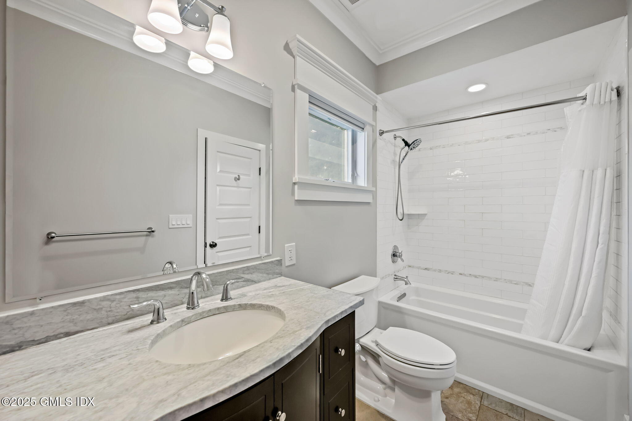 12 Old Wagon Road Old Greenwich, CT 06870 - Photo 28 of 57 a bathroom with a granite countertop sink toilet mirror and shower
