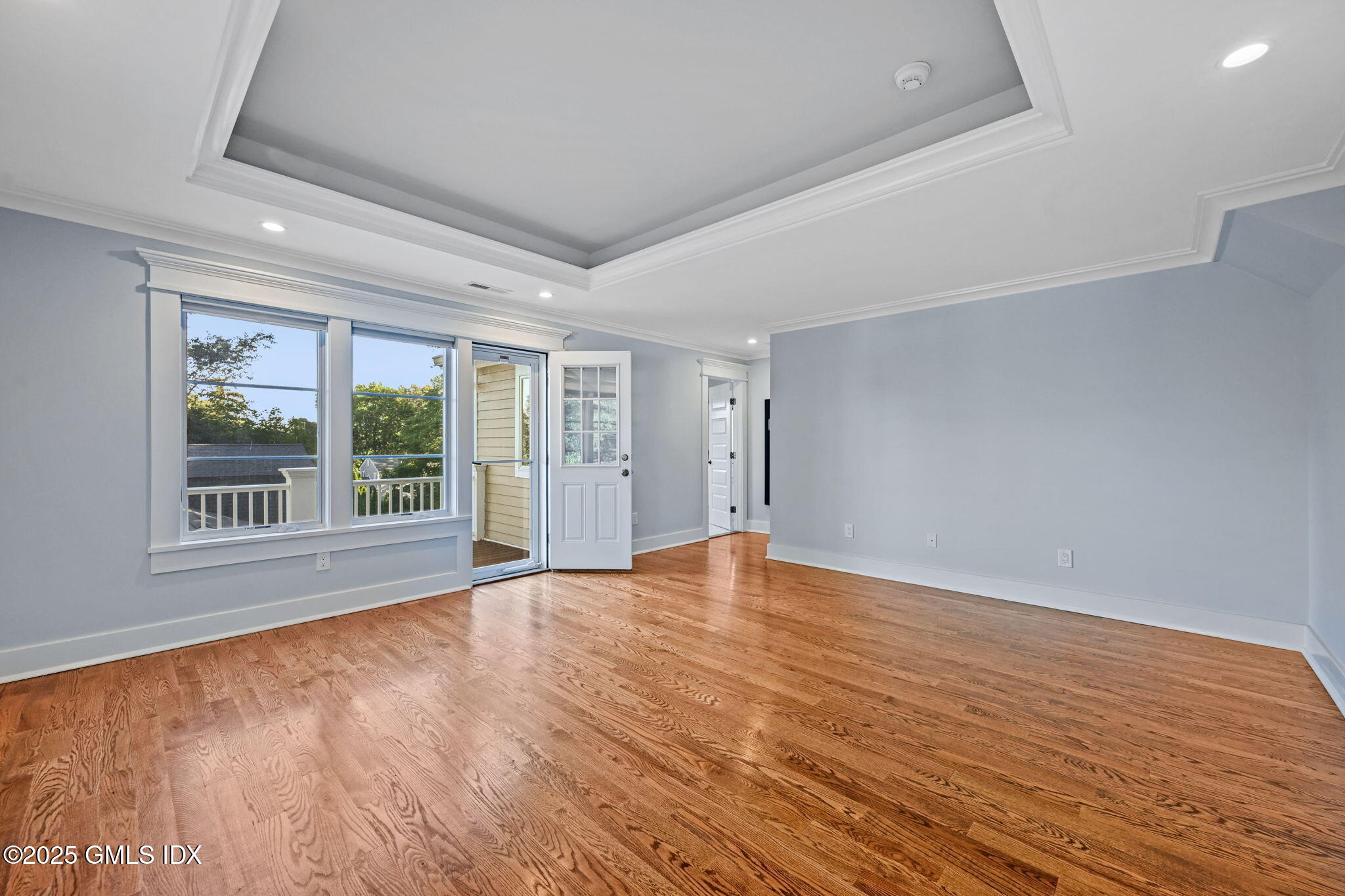 12 Old Wagon Road Old Greenwich, CT 06870 - Photo 33 of 57 a view of an empty room with wooden floor and a window