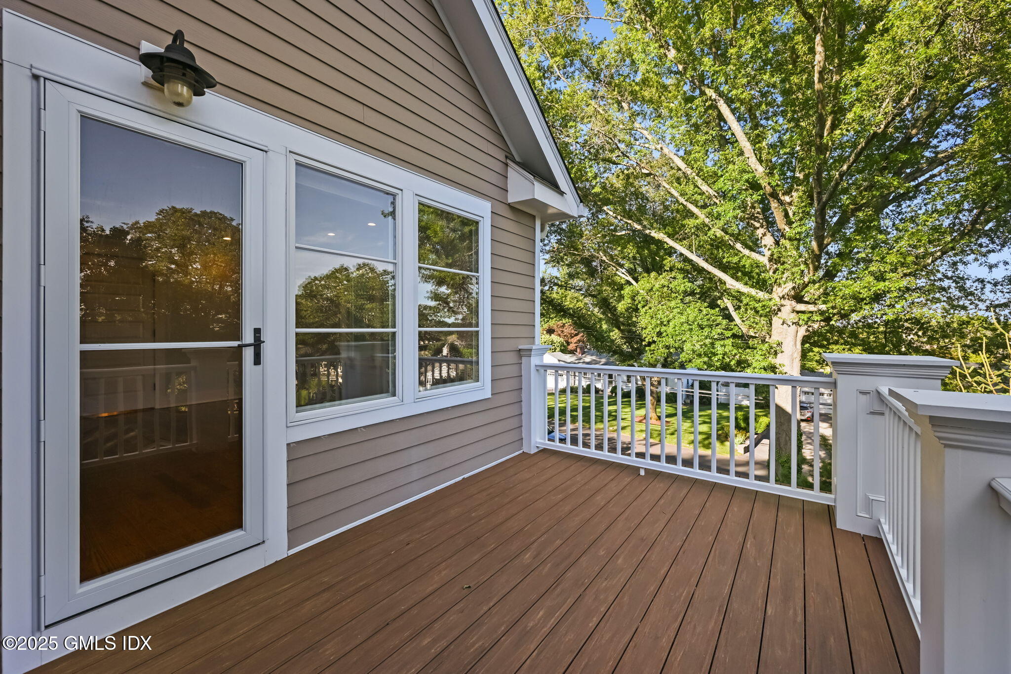 12 Old Wagon Road Old Greenwich, CT 06870 - Photo 35 of 57 a view of a balcony with wooden floor