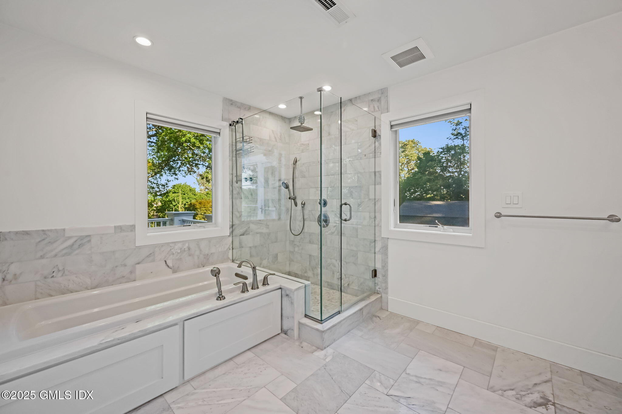 12 Old Wagon Road Old Greenwich, CT 06870 - Photo 37 of 57 a spacious bathroom with a tub shower and window
