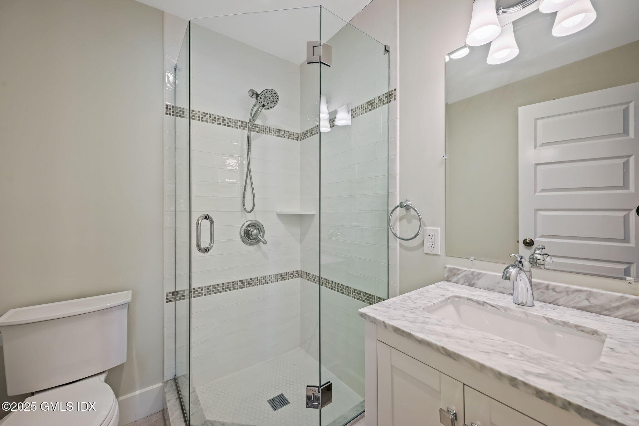 12 Old Wagon Road Old Greenwich, CT 06870 - Photo 41 of 57 a bathroom with a granite countertop sink mirror and toilet