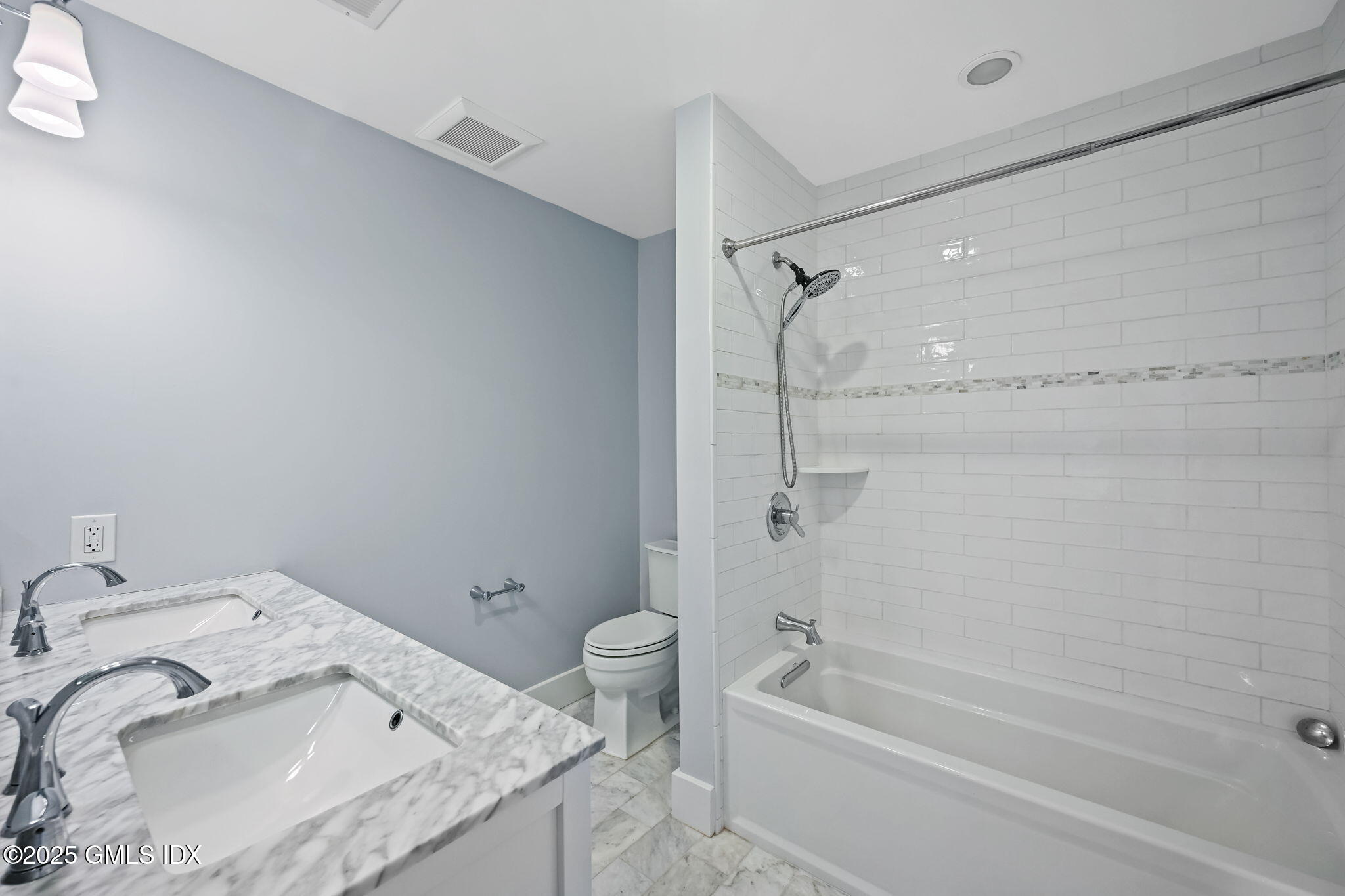 12 Old Wagon Road Old Greenwich, CT 06870 - Photo 46 of 57 a bathroom with a granite countertop sink toilet and bathtub