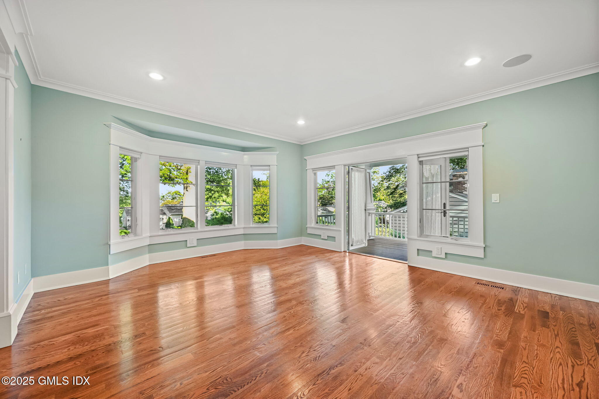 12 Old Wagon Road Old Greenwich, CT 06870 - Photo 5 of 57 a view of an empty room with wooden floor and a window