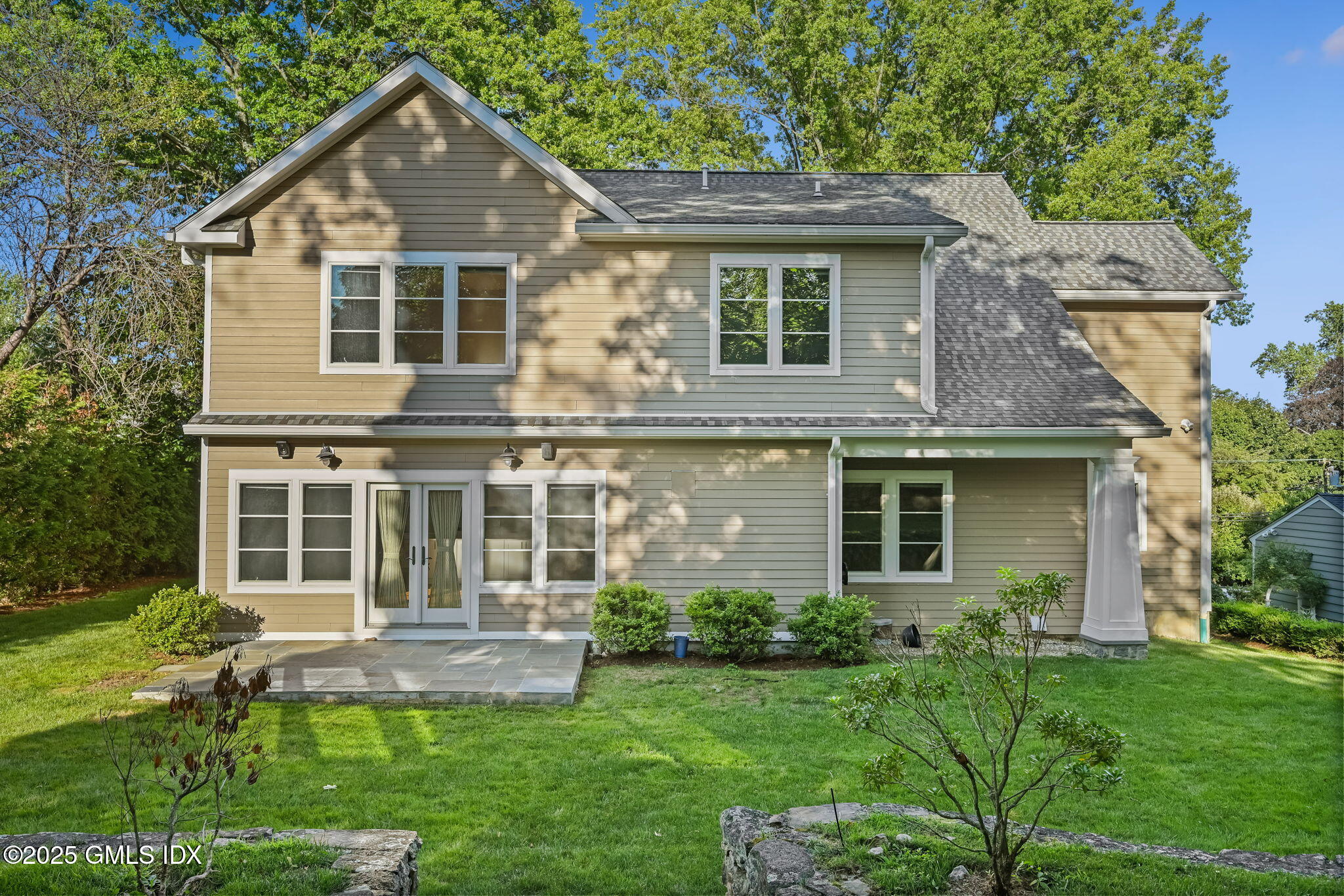12 Old Wagon Road Old Greenwich, CT 06870 - Photo 54 of 57 a front view of a house with a yard