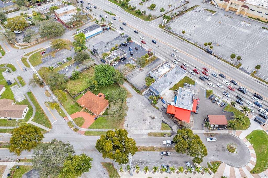 5912 Tyler Street Hollywood, FL 33021 - Photo 6 of 17 an aerial view of a house with a yard and lake view