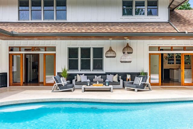 a house view with a outdoor seating
