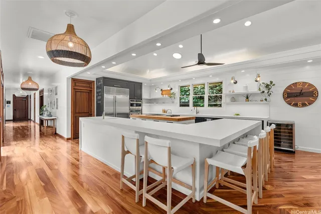 a kitchen with a stove sink and microwave