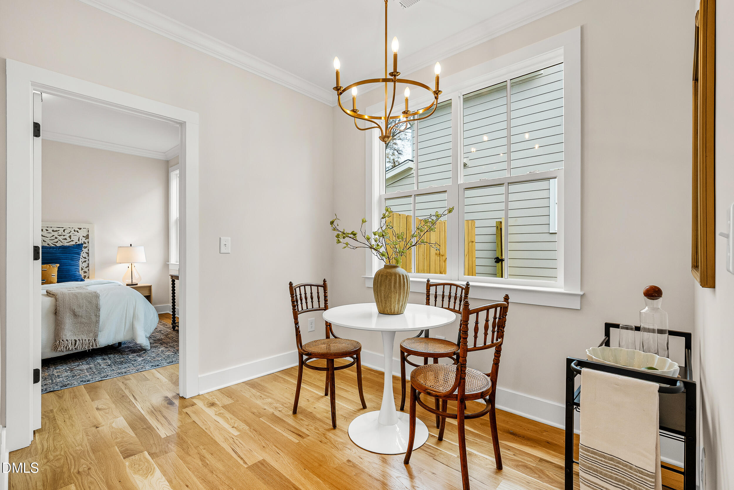 404 Chamberlin Avenue, Unit B Durham, NC 27704 - Photo 13 of 31 a view of a dining room with furniture and a window